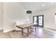 Dining area featuring hardwood floors, modern lighting, and views of the outdoors at 886 J Mccool Way, Greenwood, IN 46142