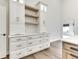Custom kitchen cabinets with quartz countertops and wooden shelving in a neutral color palette at 886 J Mccool Way, Greenwood, IN 46142