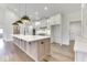 Modern kitchen with a large island, stainless steel appliances, and custom cabinets at 886 J Mccool Way, Greenwood, IN 46142