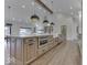 Bright kitchen showcasing a spacious island, modern appliances, and beautiful wood floors at 886 J Mccool Way, Greenwood, IN 46142