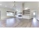 Spacious living room with hardwood floors, a fireplace, and built-in shelves at 886 J Mccool Way, Greenwood, IN 46142