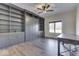 Well-lit home office featuring custom built-ins, a modern ceiling fan, and a comfortable workspace at 886 J Mccool Way, Greenwood, IN 46142