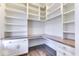 Bright home office features custom white built-ins, under cabinet lighting, and stylish wood flooring at 886 J Mccool Way, Greenwood, IN 46142