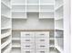 Walk-in pantry with custom white shelving, drawers, and a herringbone backsplash at 886 J Mccool Way, Greenwood, IN 46142
