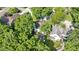 Aerial view of the home's neighborhood, showcasing mature trees, the deck, patio, and well-maintained lawns at 111 N 8Th St, Zionsville, IN 46077