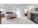 The primary bedroom boasts a fireplace, large windows, and an en-suite bathroom, offering luxury and comfort at 111 N 8Th St, Zionsville, IN 46077