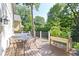 Relax on the wooden deck with outdoor furniture, perfect for enjoying the outdoors and entertaining guests at 111 N 8Th St, Zionsville, IN 46077