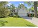 Charming home with a two-car garage, well-maintained lawn, and beautiful trees at 111 N 8Th St, Zionsville, IN 46077