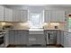 Kitchen featuring bright cabinets, large undermount sink and stainless steel dishwasher at 111 N 8Th St, Zionsville, IN 46077
