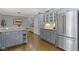 Updated kitchen includes stainless steel refrigerator, island and pendant lighting at 111 N 8Th St, Zionsville, IN 46077