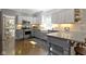Kitchen boasts ample counter space, stainless appliances and bright white cabinets at 111 N 8Th St, Zionsville, IN 46077
