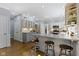 Bright and open kitchen with island seating, stainless appliances and modern lighting at 111 N 8Th St, Zionsville, IN 46077