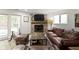 A cozy living room features a brick fireplace and comfortable seating at 111 N 8Th St, Zionsville, IN 46077