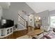 Open-concept living room with hardwood floors and a staircase at 111 N 8Th St, Zionsville, IN 46077
