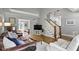 Spacious living room with hardwood floors, comfortable seating, and open layout at 111 N 8Th St, Zionsville, IN 46077