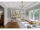 Inviting playroom with storage, hardwood floors, natural light, and stylish decor at 111 N 8Th St, Zionsville, IN 46077
