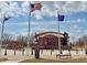 Picture of the DriveHubler.com community center with flags under a beautiful sky at 1114 Winterfield Blvd, Franklin, IN 46131