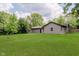 Spacious backyard, surrounded by mature trees, is perfect for entertaining at 11230 N College Ave, Carmel, IN 46032