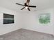 Bedroom with carpeting, ceiling fan and a double set of windows, offering ample natural light at 11230 N College Ave, Carmel, IN 46032
