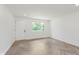 Bright bedroom with herringbone floors and a view of the outdoors at 11230 N College Ave, Carmel, IN 46032