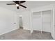Bedroom with a closet, and plush gray carpet at 11230 N College Ave, Carmel, IN 46032