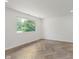 Bright bedroom with herringbone floors and a view of the outdoors at 11230 N College Ave, Carmel, IN 46032
