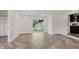 Bright living room featuring new flooring, natural light, and a sliding glass door at 11230 N College Ave, Carmel, IN 46032