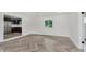 Bright living room featuring new flooring, natural light, and a sliding glass door at 11230 N College Ave, Carmel, IN 46032