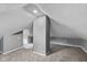 Finished attic space featuring neutral paint, carpeting, and electrical outlets for various uses at 1141 W 35Th St, Indianapolis, IN 46208