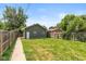 Backyard with a green lawn and a wooden fence at 1141 W 35Th St, Indianapolis, IN 46208