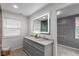 Modern bathroom with double vanity, granite countertop, and illuminated mirror, creating a luxurious feel at 1141 W 35Th St, Indianapolis, IN 46208
