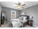 Serene bedroom featuring a ceiling fan, two windows, and tastefully appointed furnishings at 1141 W 35Th St, Indianapolis, IN 46208