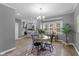 Bright dining area with a modern chandelier and large windows offering ample natural light at 1141 W 35Th St, Indianapolis, IN 46208