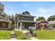 Attractive two-story home with a classic design and inviting front porch and manicured lawn at 1141 W 35Th St, Indianapolis, IN 46208