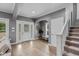 Elegant foyer with hardwood floors, decorative lighting, and staircase at 1141 W 35Th St, Indianapolis, IN 46208