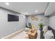 Cozy living room with a black sofa, wooden coffee table, and stylish decor at 1141 W 35Th St, Indianapolis, IN 46208