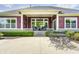 Backyard patio with outdoor seating, ceiling fan, and well-maintained landscaping at 11626 Laurel Springs Cir, Noblesville, IN 46060