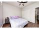 Cozy bedroom features a ceiling fan, wood floors, and a double door closet for ample storage space at 11626 Laurel Springs Cir, Noblesville, IN 46060