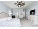 Spacious bedroom featuring light blue walls, carpeted floors, a ceiling fan and neutral toned furniture at 11626 Laurel Springs Cir, Noblesville, IN 46060