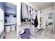 Walk-in closet leading to the laundry room featuring custom shelving and storage solutions at 11626 Laurel Springs Cir, Noblesville, IN 46060