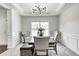 Elegant dining room with modern chandelier, trim and wainscoting at 11626 Laurel Springs Cir, Noblesville, IN 46060