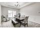 Cozy dining room with modern lighting, neutral colors, and plenty of seating at 11626 Laurel Springs Cir, Noblesville, IN 46060