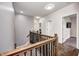 Well-lit hallway with hardwood floors and views to other rooms in the house at 11626 Laurel Springs Cir, Noblesville, IN 46060