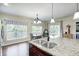 Well-lit kitchen with stainless steel appliances, granite countertops and modern sink at 11626 Laurel Springs Cir, Noblesville, IN 46060