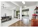 Open-concept living and dining area boasts hardwood floors and modern lighting fixtures and neutral-colored decor at 11626 Laurel Springs Cir, Noblesville, IN 46060