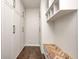 Functional mudroom featuring a custom built-in bench, cubbies, and closet for storage and organization at 11626 Laurel Springs Cir, Noblesville, IN 46060