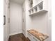 Spacious mudroom featuring a custom built-in bench, cubbies, and closet for storage and organization at 11626 Laurel Springs Cir, Noblesville, IN 46060