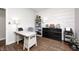 Bright office space has shiplap accent wall, desk, storage and shelving for an organized workspace at 11626 Laurel Springs Cir, Noblesville, IN 46060