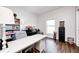 Comfortable office space has shiplap accent wall, desk, storage and natural light at 11626 Laurel Springs Cir, Noblesville, IN 46060