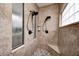 Shower featuring double shower heads, tiled walls and floors, and a built-in corner seat at 11626 Laurel Springs Cir, Noblesville, IN 46060
